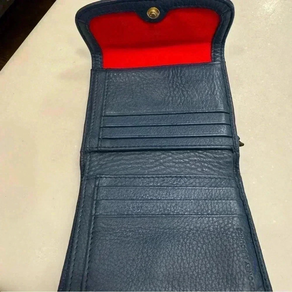 Navy blue pebble leather trifold wallet. Red interior. Perfect condition - Picture 7 of 10